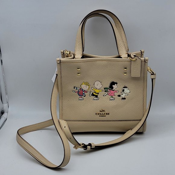 Coach Peanuts Dempsey Tote 22 with Snoopy and Friends Motif CE850 Ivory Multi - Picture 1 of 8